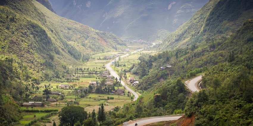 Picturesque view of the came valley, with lush valley and a beautiful stream meandering through