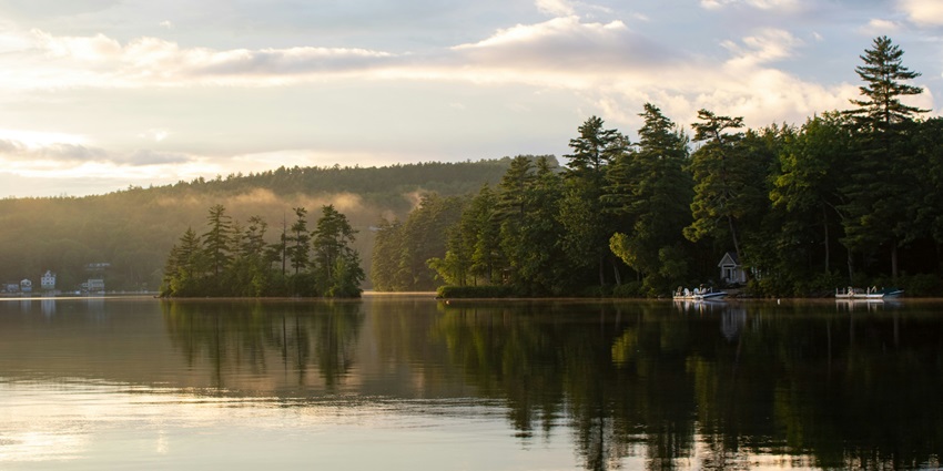 Picturesque view of the Kalote lake, surrounded by lush greenery