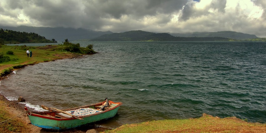 Serene Arthur Lake in Bhandardara surrounded by Sahyadri hills and calm waters