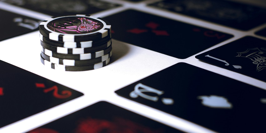 An inside view of a leisure hub in Barcelona, Spain featuring a poker table and cards.