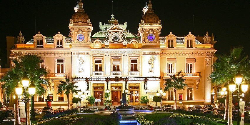 A night view of the Casino De Monte-Carlo, Monaco adorned with dazzling lights.