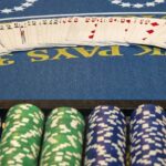 Coins stacked and cards laid before a gaming session at the casinos in Nepalgunj