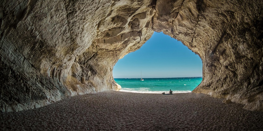 An image of stunning sea caves along the coastline of Pandawa Beach.