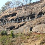 A glimpse of a famous tourist attraction featuring majestic peaks and lush greenery.