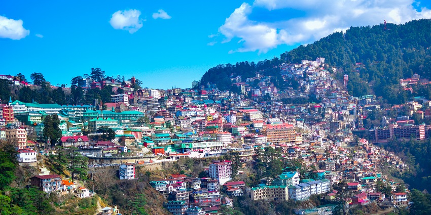Scenic view of mountains and city, perfect for road trips from Chandigarh.