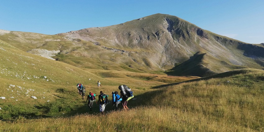 An image of the hikers on the Chaturshringi Hill trail, with the clear blue sky in the background