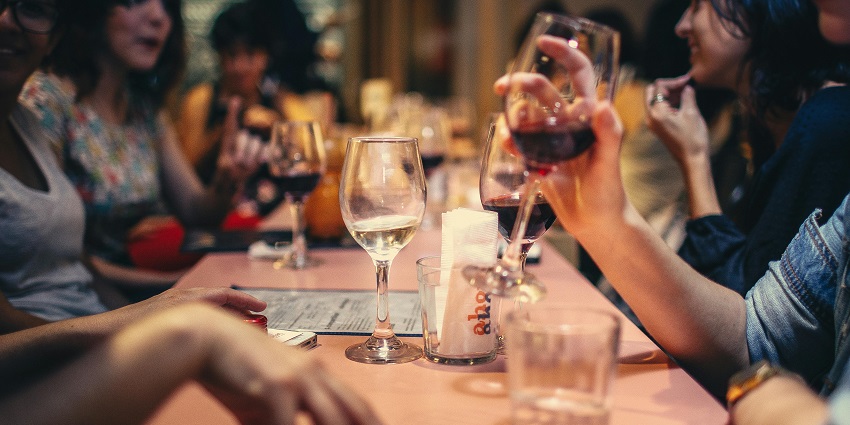 Image of people enjoying in a bar and drinking with glass - enjoy the nightlife in Amritsar
