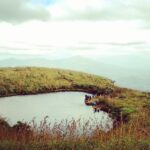 An image of a heart-shaped lake in Wayanad where one can trek to get amazing views.