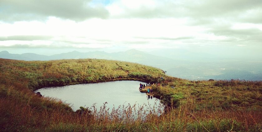 An image of a heart-shaped lake in Wayanad where one can trek to get amazing views.