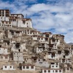 Image of Chemrey Gompa viewed from the southwest on top of the hill under clear blue sky