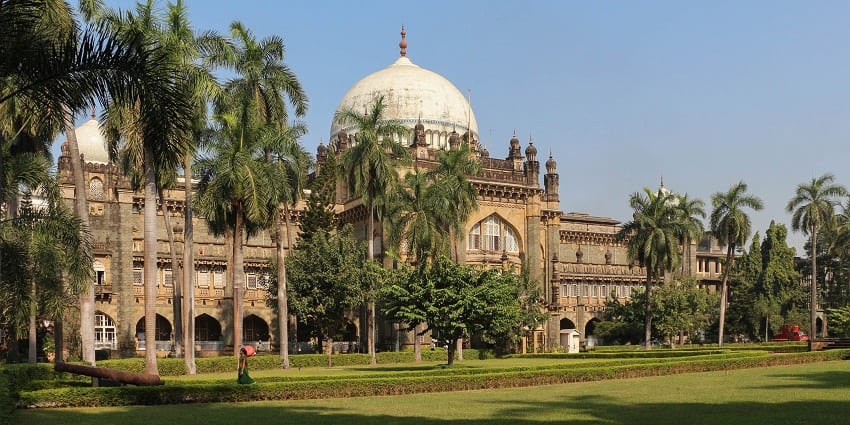 A wooden, intricately adorned architectural prototype in the city’s renowned museum.