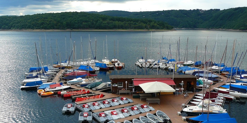 Docked boats around the shore of a city lake in Chhota Kashmir boat club, Mumbai