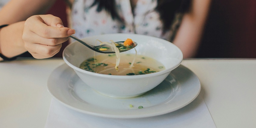 An image of a vegetarian Chhurpi soup bowl, the best food in Leh, Jammu and Kashmir.