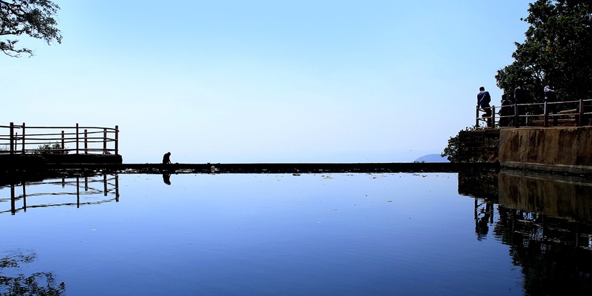 A Scenic reflection in water in the evening at Chikhaldara, near Melghat National Park, Maharashtra.