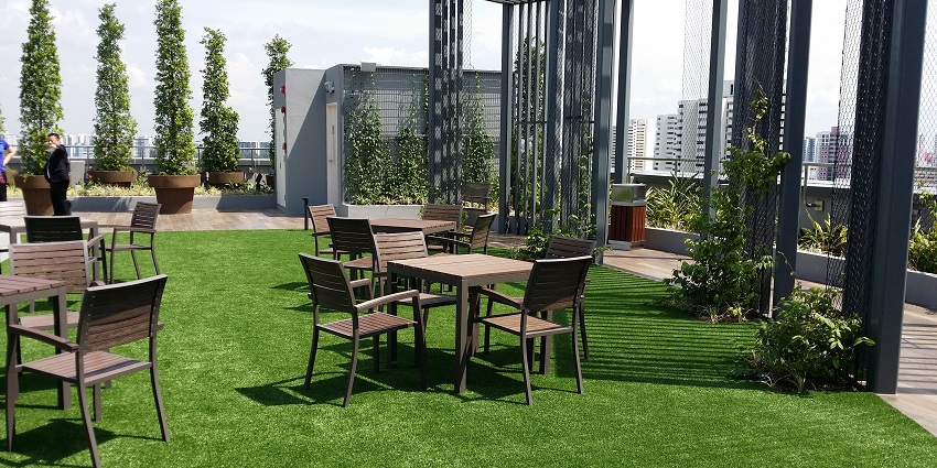 A cozy rooftop restaurant with beautiful city views, ambient lighting, and delicious food.