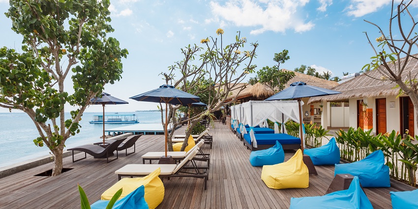 The beach club with cabins and lounge chairs, one of the best things to do in Seminyak.