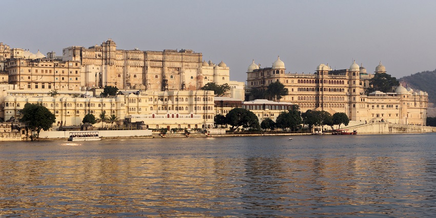 Majestic City Palace of Udaipur with its intricate architecture behind the Lake Pichola