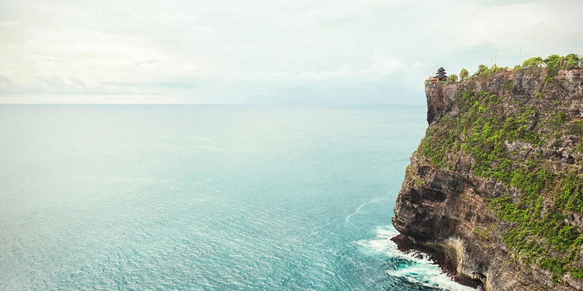 An image showing cliffs beside the vibrant blue sea