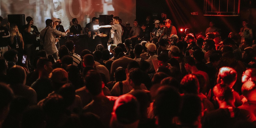 Live band performing on the stage with the crowd jamming