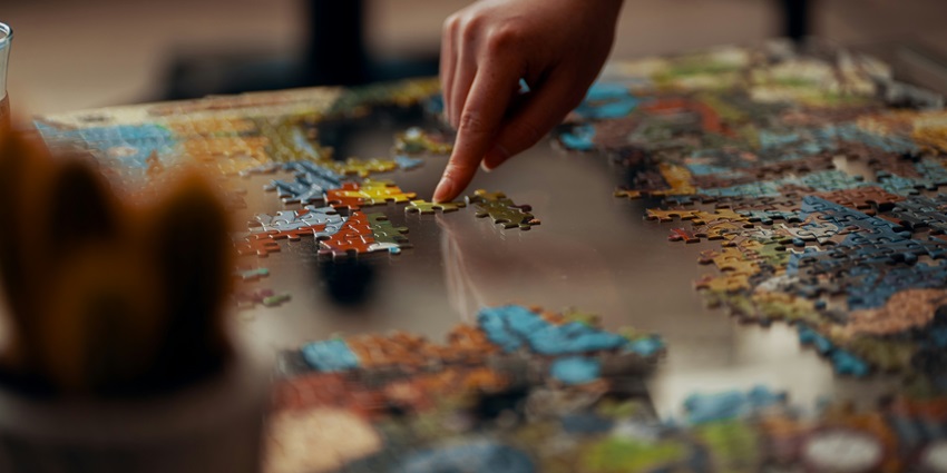 An image of people trying to find out a clue in a clue hunt game with different hints.
