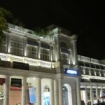 Front view of CP building, offering the gist of Connaught place nightlife