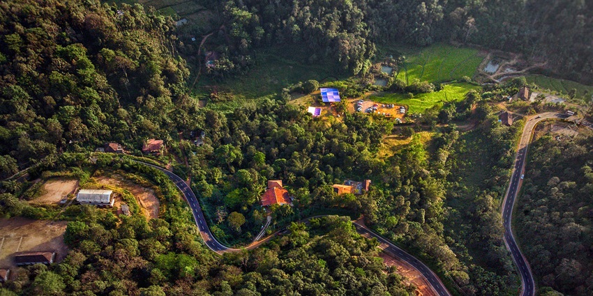 An image of the panoramic Coorg with coffee plantations and lush landscapes.