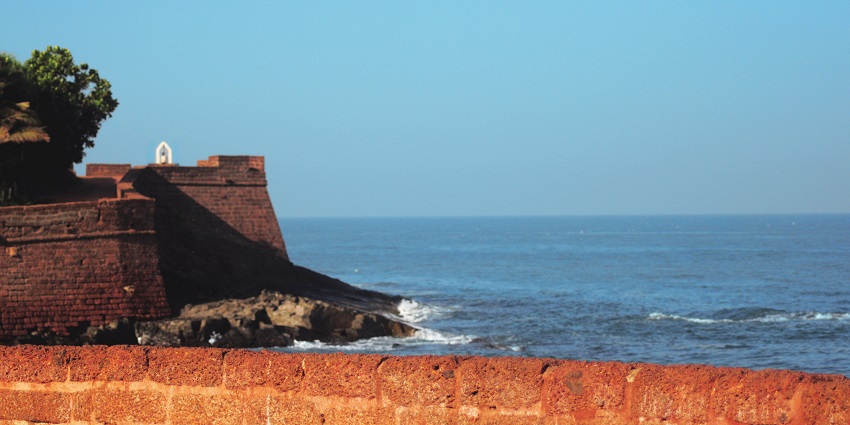 The beautiful lush greenery of ancient Corjuem Fort, which houses a chapel beneath.