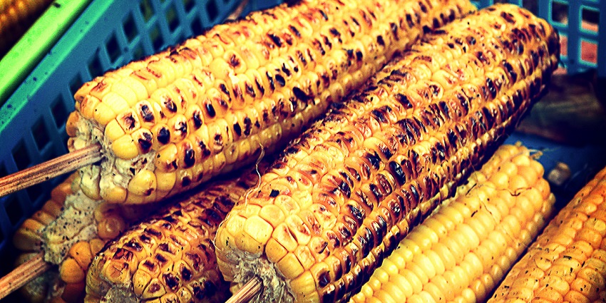 Street food in Ooty includes grilled corn seasoned with spices, a delightful street food