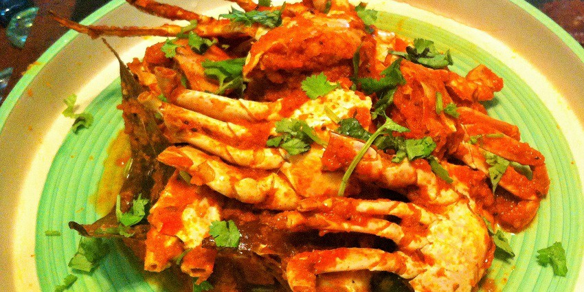 A glimpse of Crab Masala Fry, a spicy fried crab dish, bursting with flavours, seafood delight.