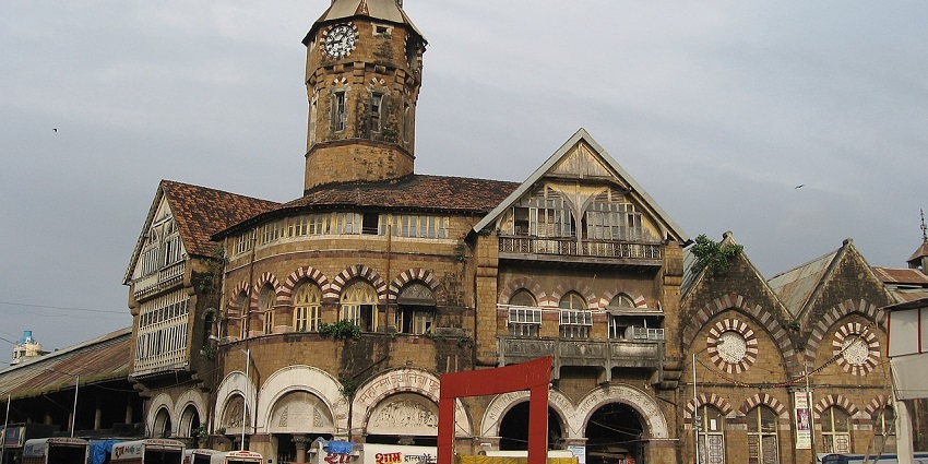View of a old building amidst the streets of the crawford market