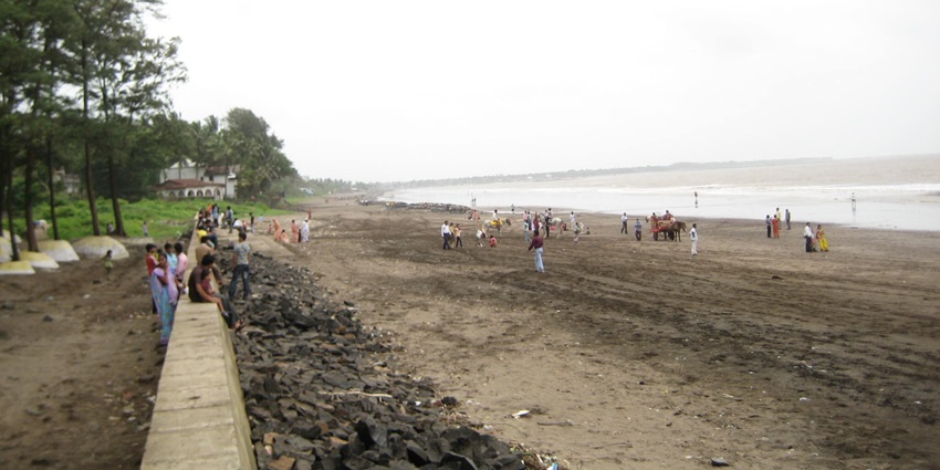 Serene view of Dahanu Beach with sandy shore, a famous place near Bahrot Caves