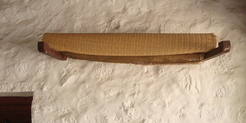 A woven mat on a hanger at Dakshinachitra Heritage Museum near Chennai, Tamil Nadu.