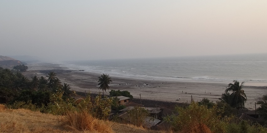 The beautiful coastline of Dapoli, surrounded by lush greenery during the monsoon season.