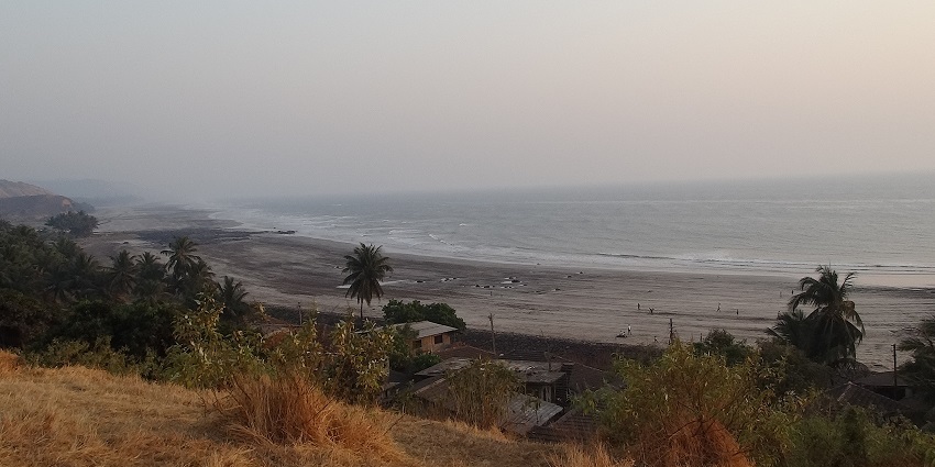 Scenic view of Dapoli Beach, a popular destination near Nangartas Waterfall