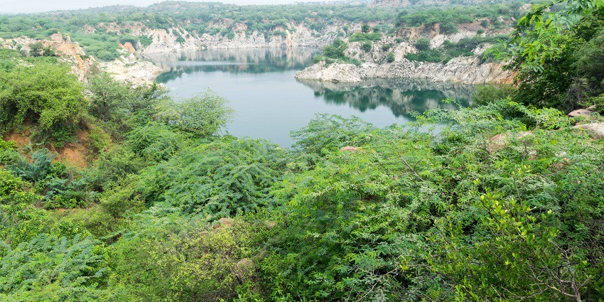 Aerial view of the beautiful Death valley lake amidst the hills of Aravalli in Haryana