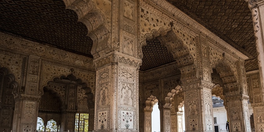 A glimpse of vibrant designs and engravings of temples are depicted in this image.
