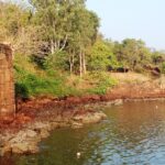 The aerial view of Devgad Fort with its fortifications overlooking the Arabian Sea