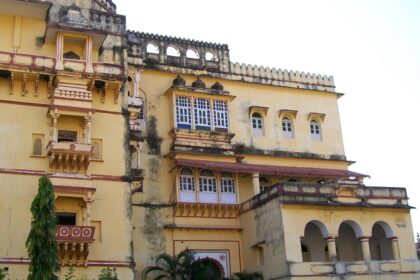 Badal Mahal in Deogarh Fort with intricate stone architecture surrounded by hilly terrain