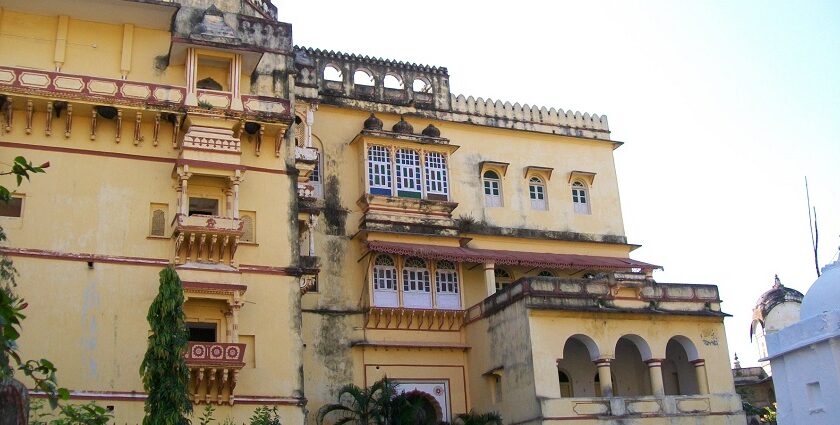 Badal Mahal in Deogarh Fort with intricate stone architecture surrounded by hilly terrain