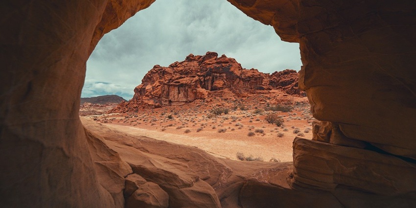 Nature cave nestled in a valley, a tourist attraction near Maharashtra, inviting exploration.