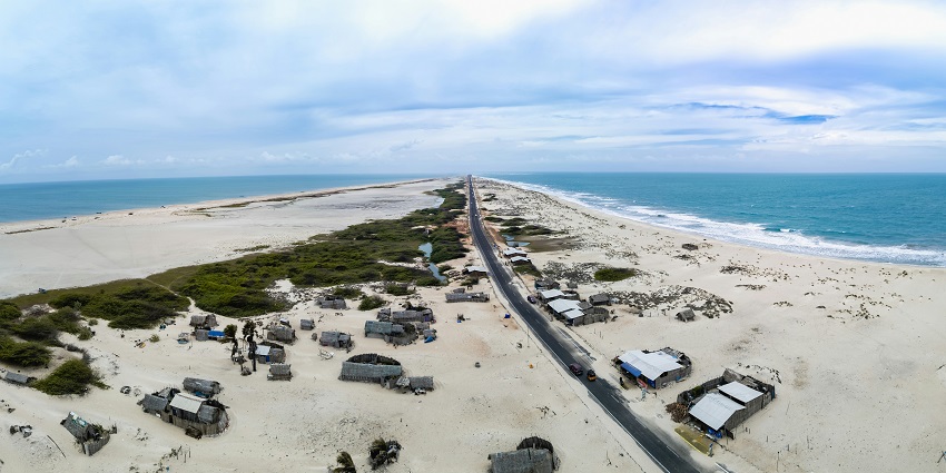 A picture of a beach with cars parked at one of the top places to visit in Dhanushkodi.