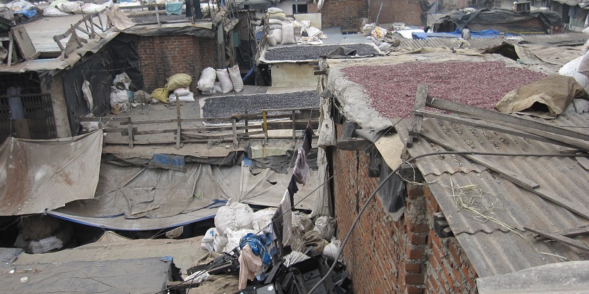 Dharavi slum in Mumbai, India, showcasing crowded buildings and narrow streets
