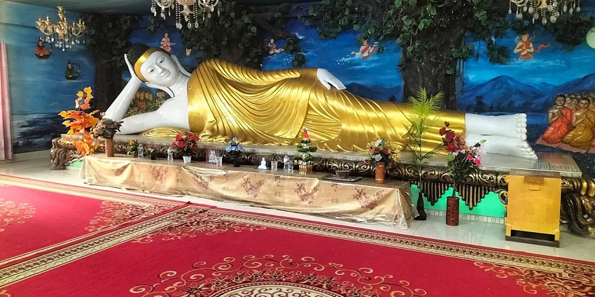 Buddha statue inside the prayer hall of Dharmarajika Bauddha Vihara, Dhaka