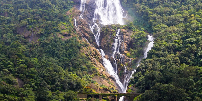 A view of Dudhsagar Waterfalls, a famous place near Kachargadh caves, cascading down a cliff.