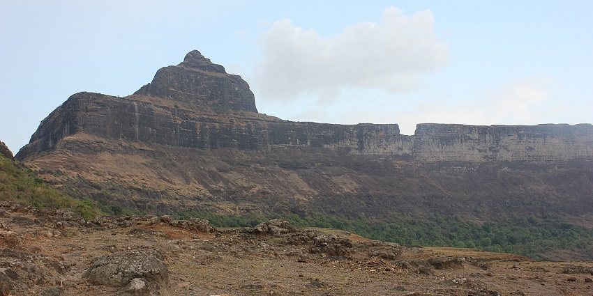 Dhodap Fort offers stunning panoramic views, ancient ruins, and towering cliffs.