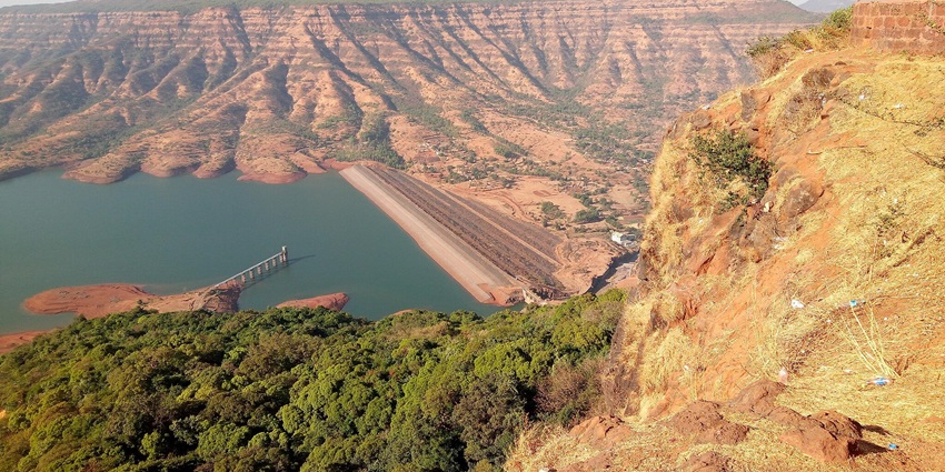 Dhom Dam is a serene spot for boating and water sports activities.