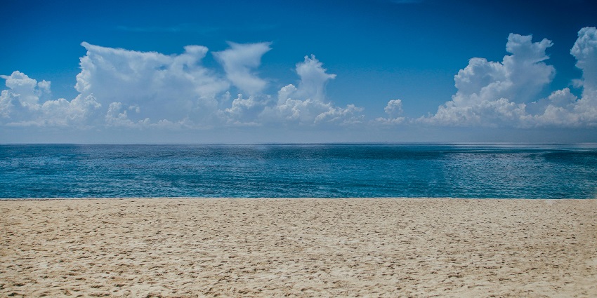 A glimpse of the serene Kihim Beach featuring pristine golden sands and azure waves.