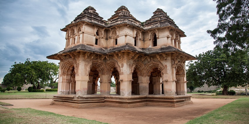 Image of Lotus Mahal surrounded by lush greenery - discover best things to do in Ballari