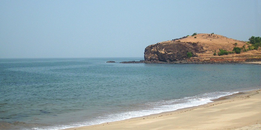 Places to visit in Shrivarshan feature Diveagar Beach with serene waters and surroundings.
