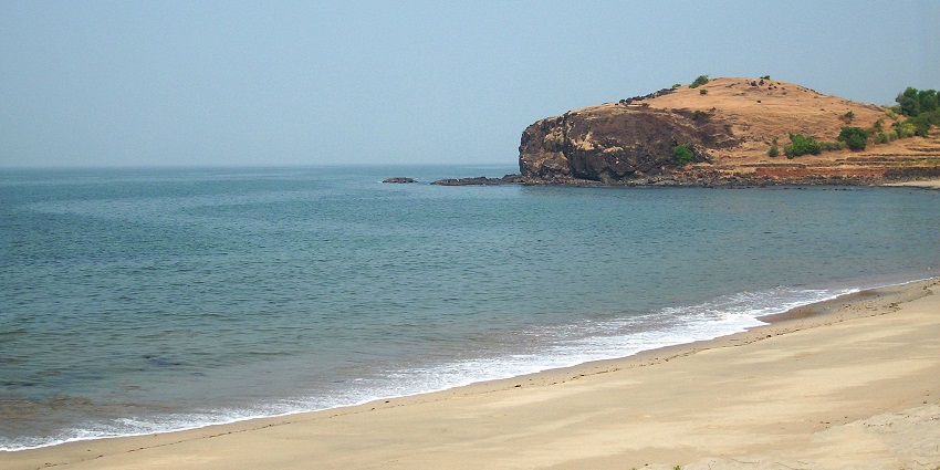 A stunning view of Diveagar Beach showcasing its serene coastline and clear blue waters.